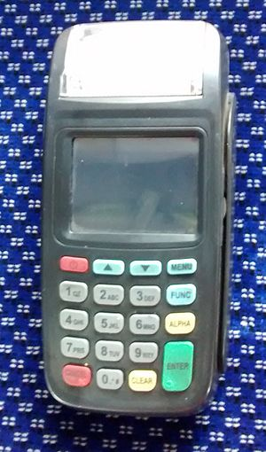 An old e-ticket machine. It has a screen and buttons with numbers