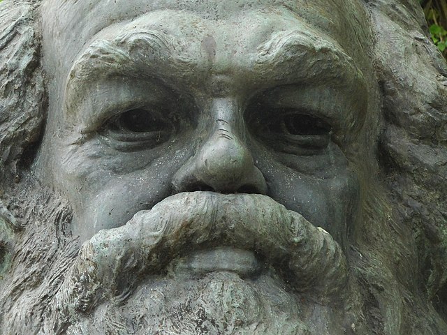 Face of Karl Marx on his grave at Highgate Cemetery in north London