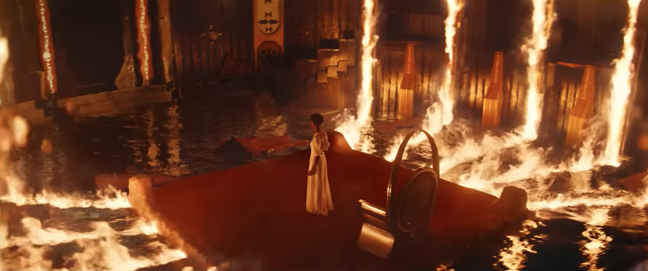 Shuri standing in a crown room in fire in her visit to the ancestral plane